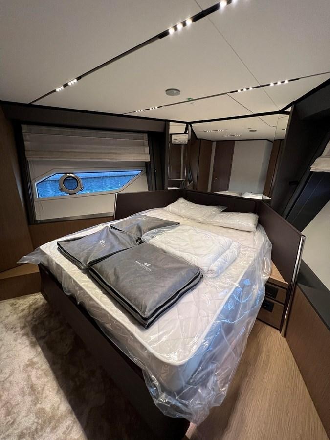 a bed in a room aboard AISULU Yacht for Sale