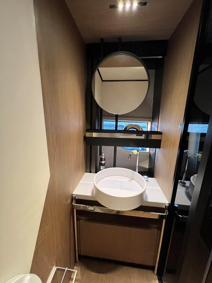 a bathroom with a large mirror aboard AISULU Yacht for Sale