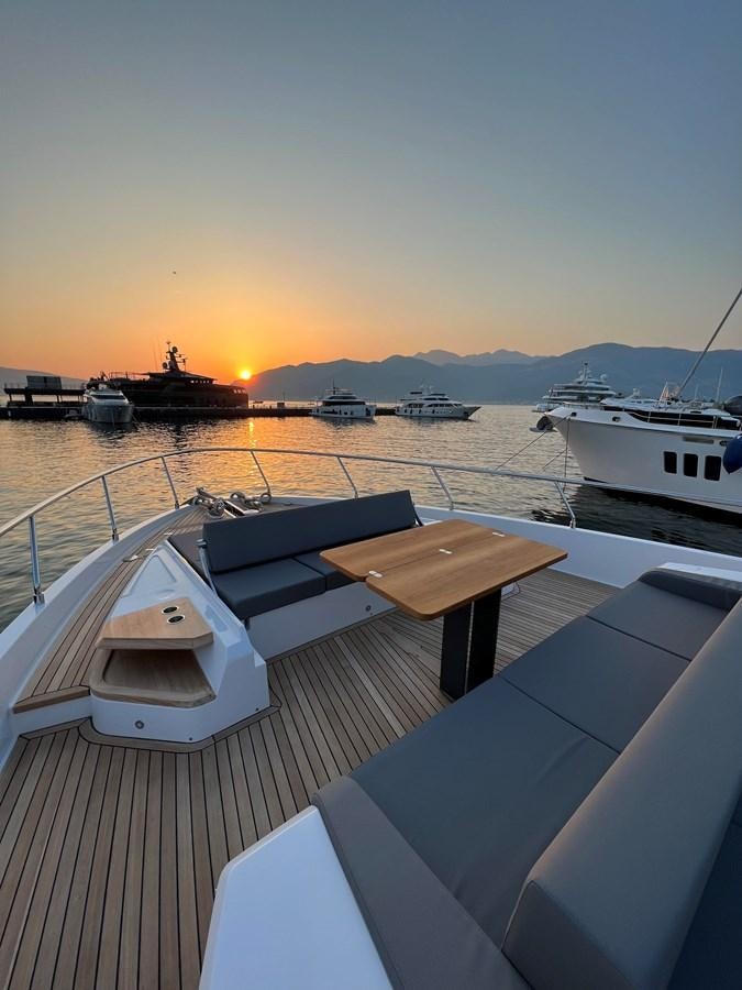 a deck with boats on it aboard AISULU Yacht for Sale