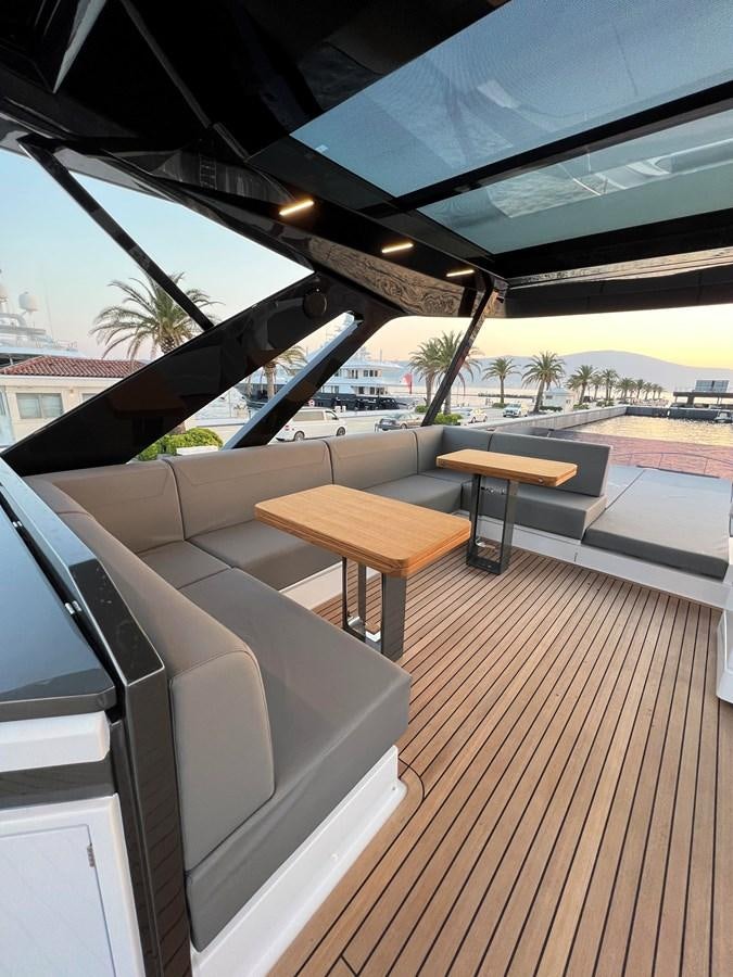 a room with a deck and a pool aboard AISULU Yacht for Sale