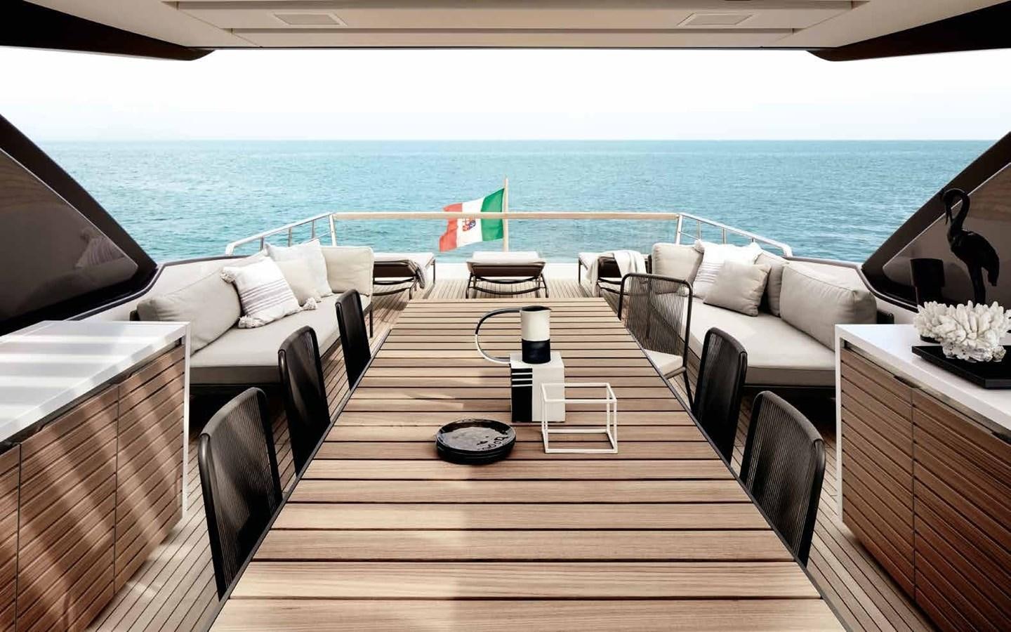 a deck with chairs and tables on it aboard 2017 SANLORENZO SL86 # 676 Yacht for Sale