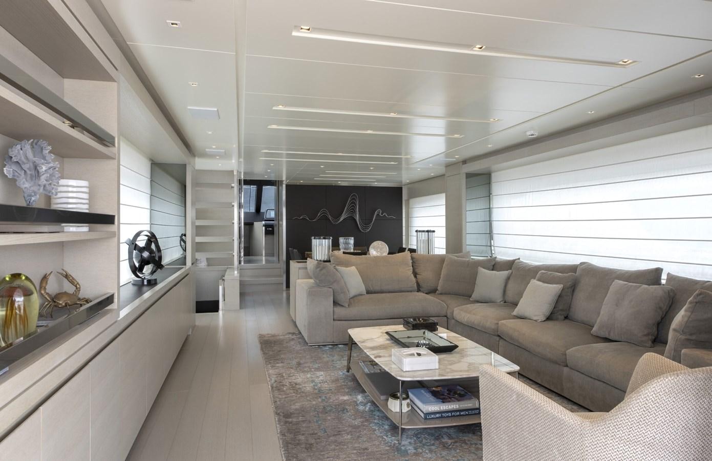 a living room with a couch and a coffee table aboard 2017 SANLORENZO SL86 # 676 Yacht for Sale