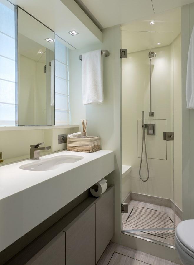 a bathroom with a sink and a mirror aboard 2017 SANLORENZO SL86 # 676 Yacht for Sale