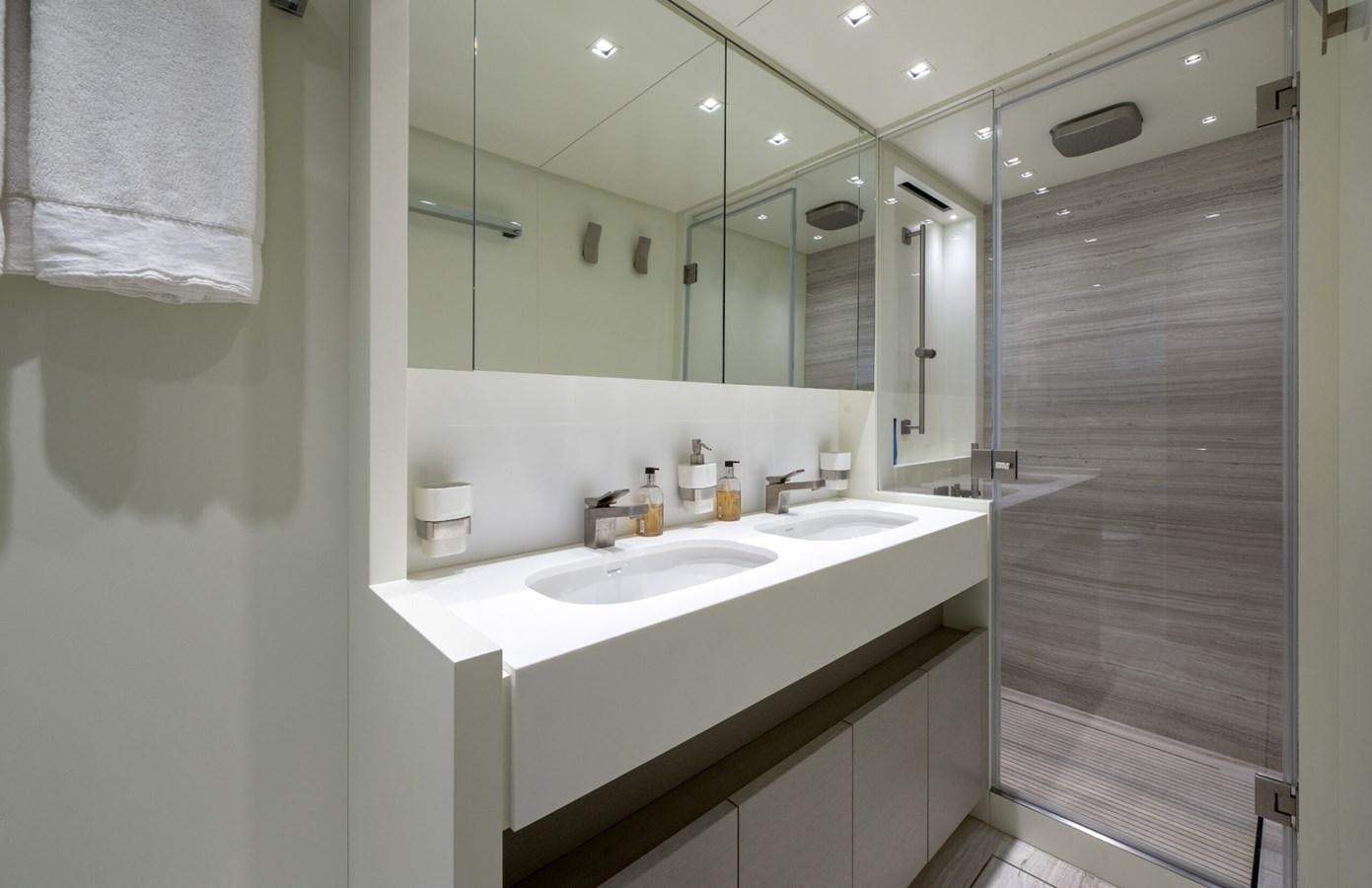 a bathroom with a sink and a mirror aboard 2017 SANLORENZO SL86 # 676 Yacht for Sale