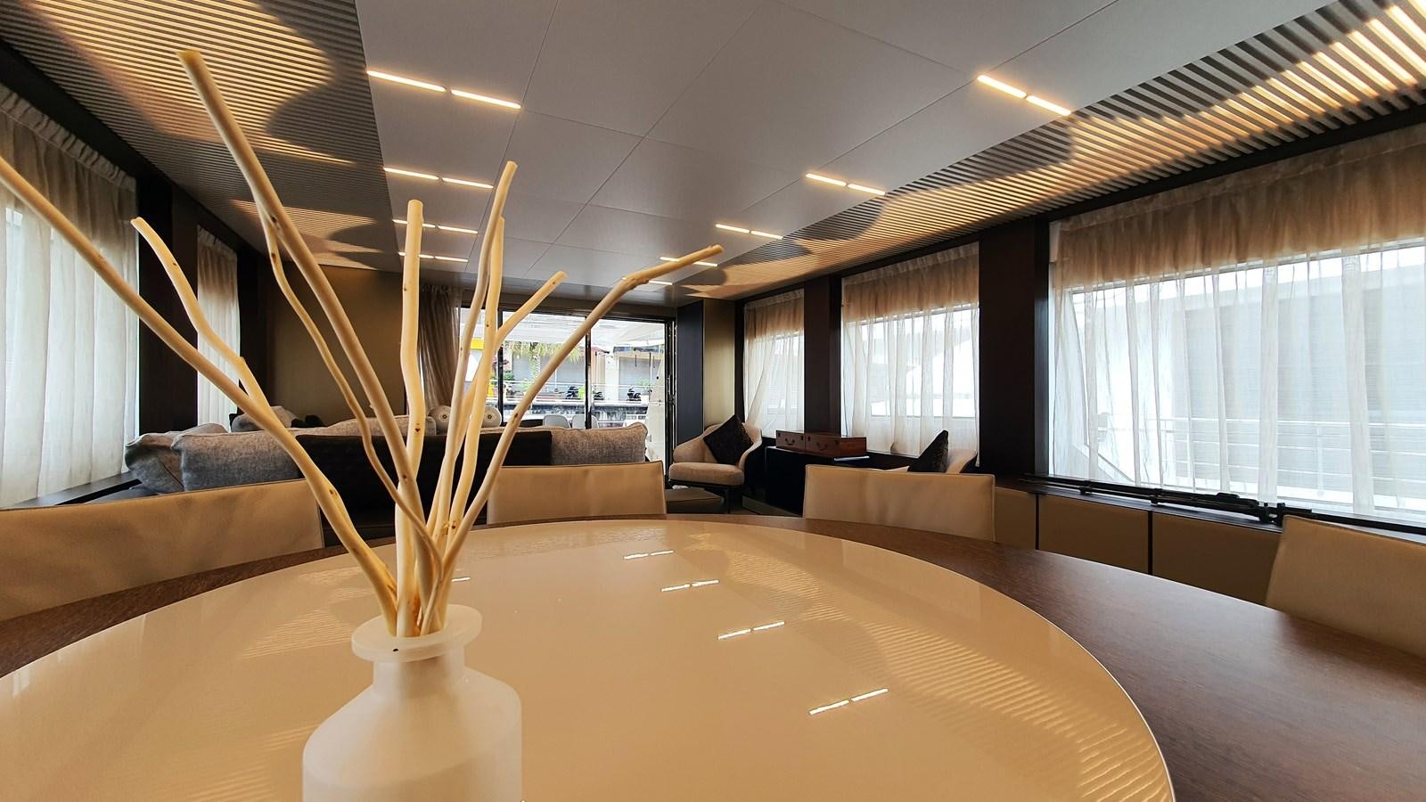 a large room with a large table and chairs aboard WHITE SHARK Yacht for Sale