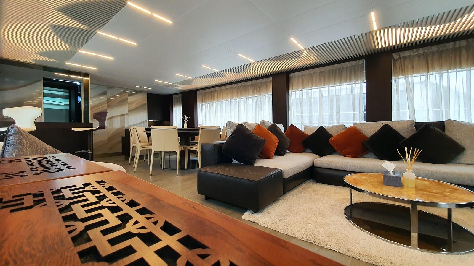 a living room with a couch and a table aboard WHITE SHARK Yacht for Sale