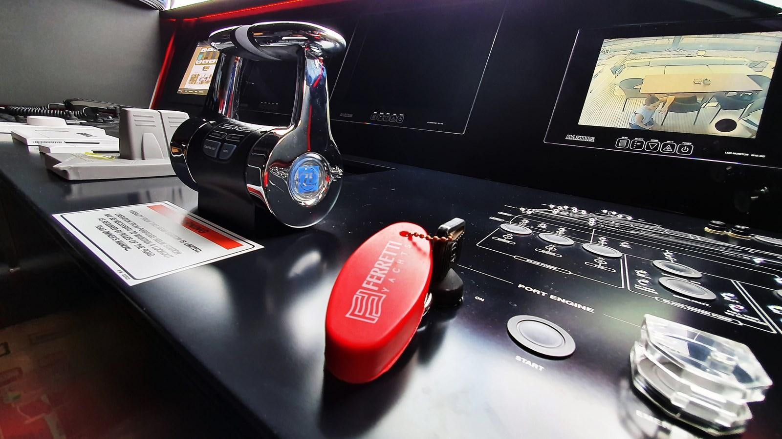 a black computer desk with a red and black car on it aboard WHITE SHARK Yacht for Sale