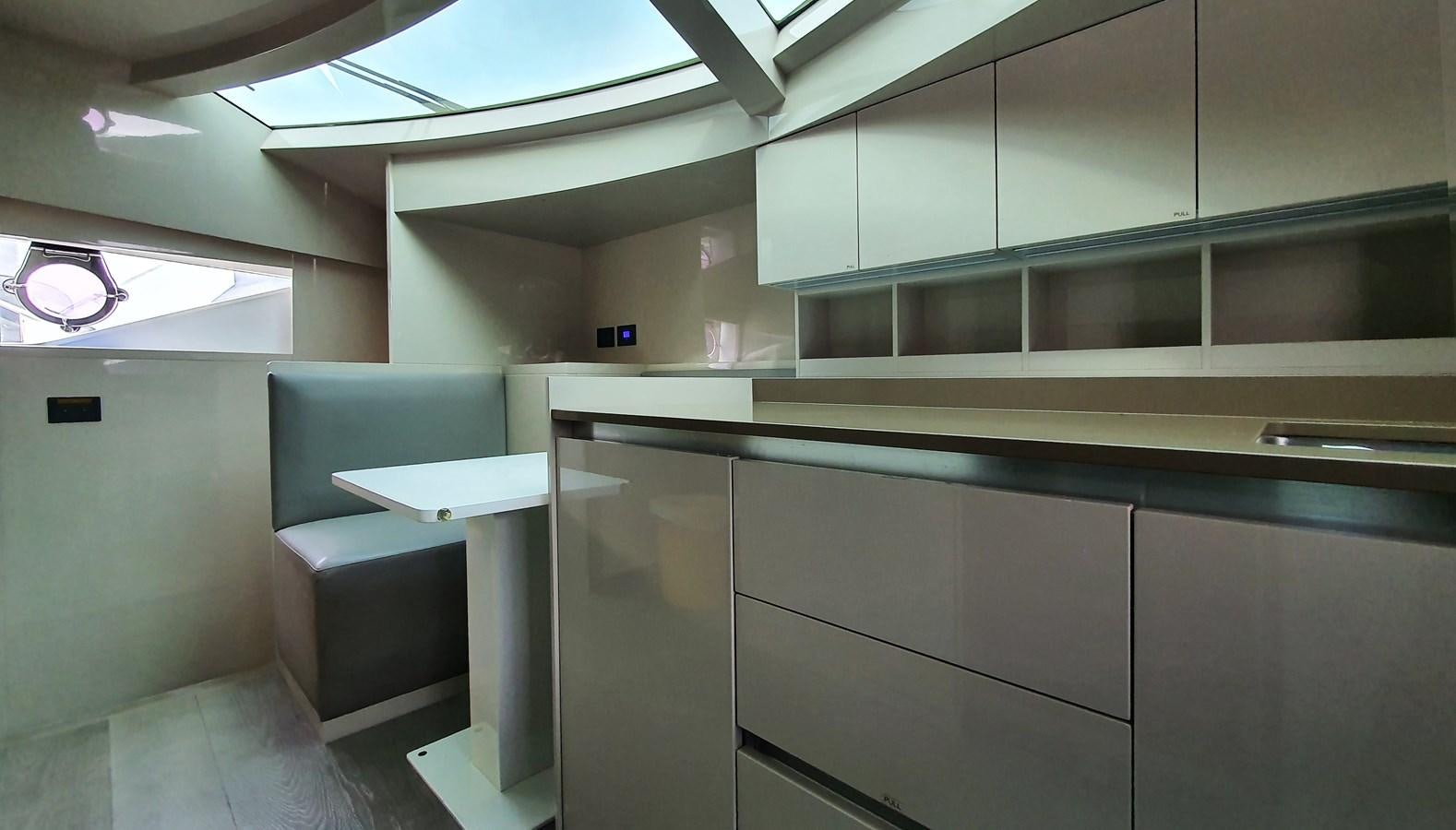 a room with a desk and a chair aboard WHITE SHARK Yacht for Sale