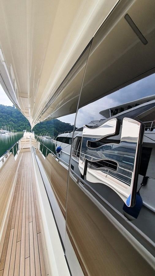 a deck with a railing and a railing with a view of the mountains aboard WHITE SHARK Yacht for Sale