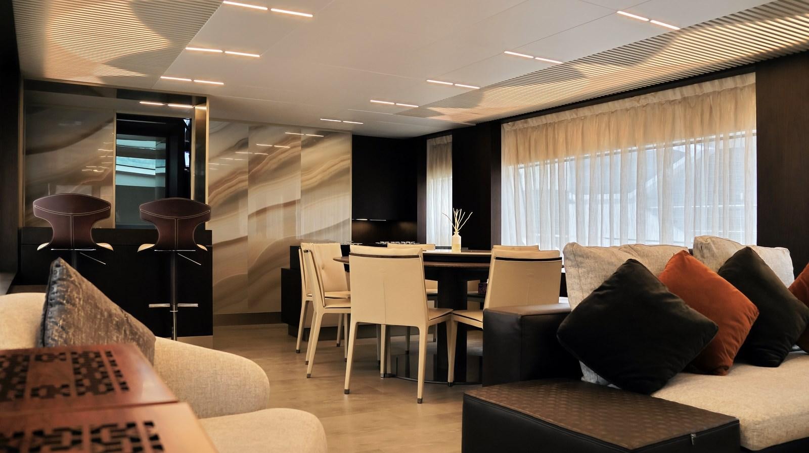 a living room with a couch and a table aboard WHITE SHARK Yacht for Sale