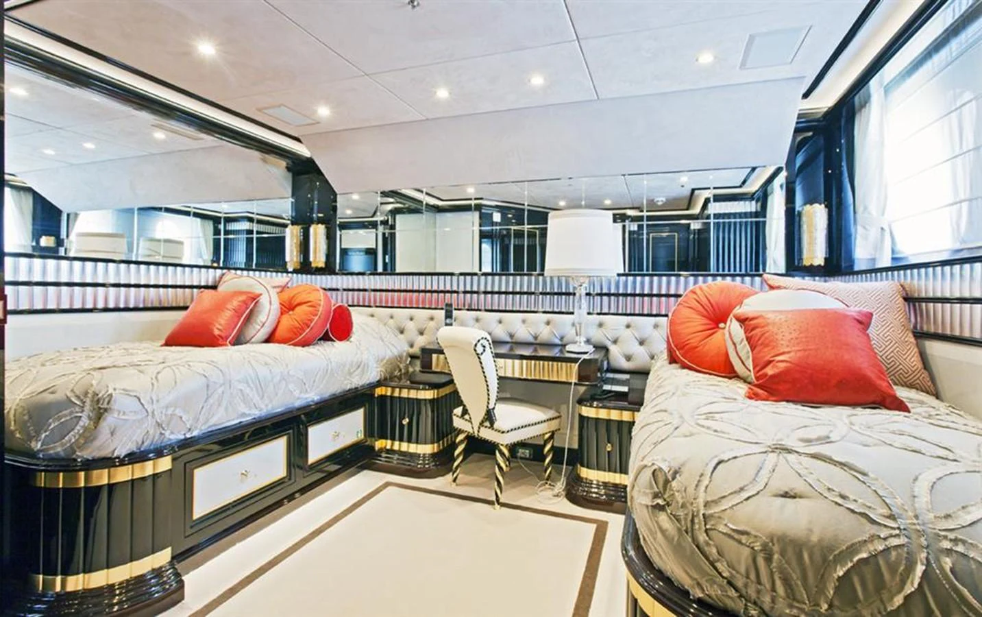 a room with a bed and a chair aboard ALEXANDER AGAIN Yacht for Sale