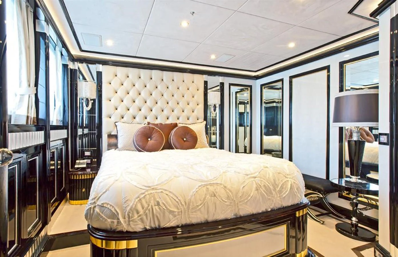 a bedroom with a bed and a lamp aboard ALEXANDER AGAIN Yacht for Sale