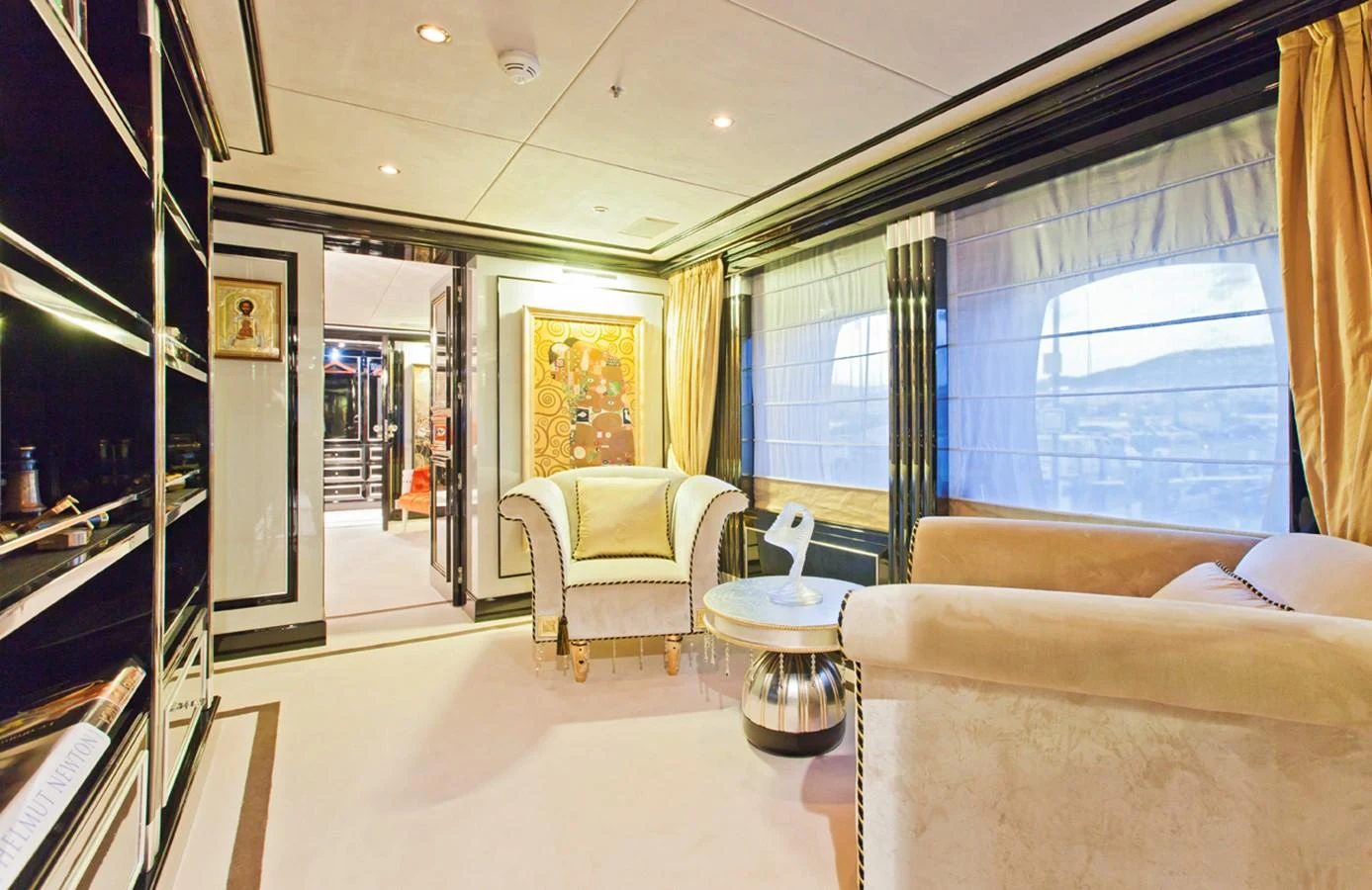 a room with a glass table and chairs and a window aboard ALEXANDER AGAIN Yacht for Sale
