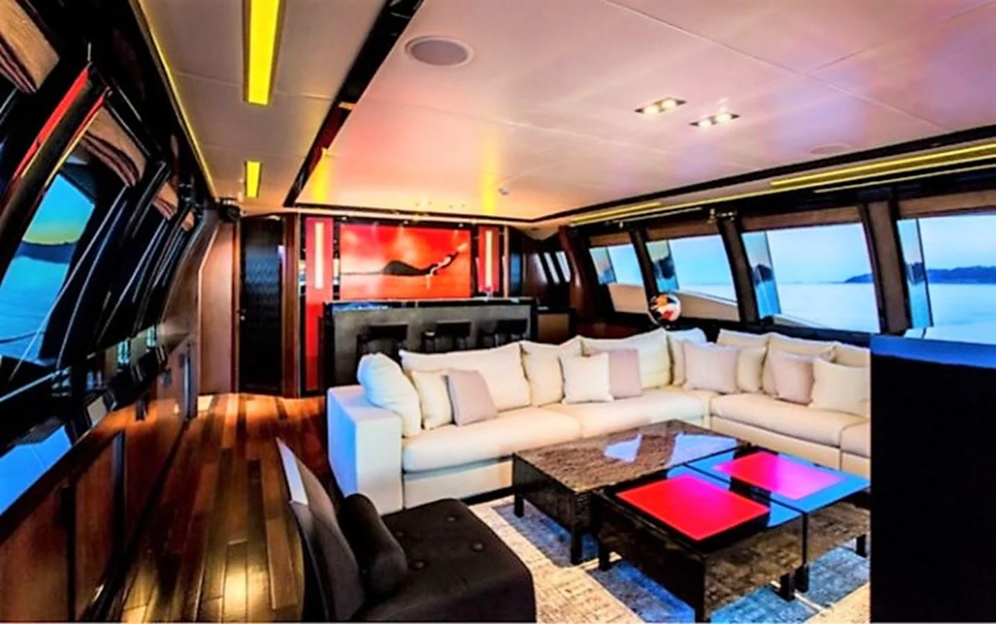 a living room with a large screen aboard MY IZUMI Yacht for Sale