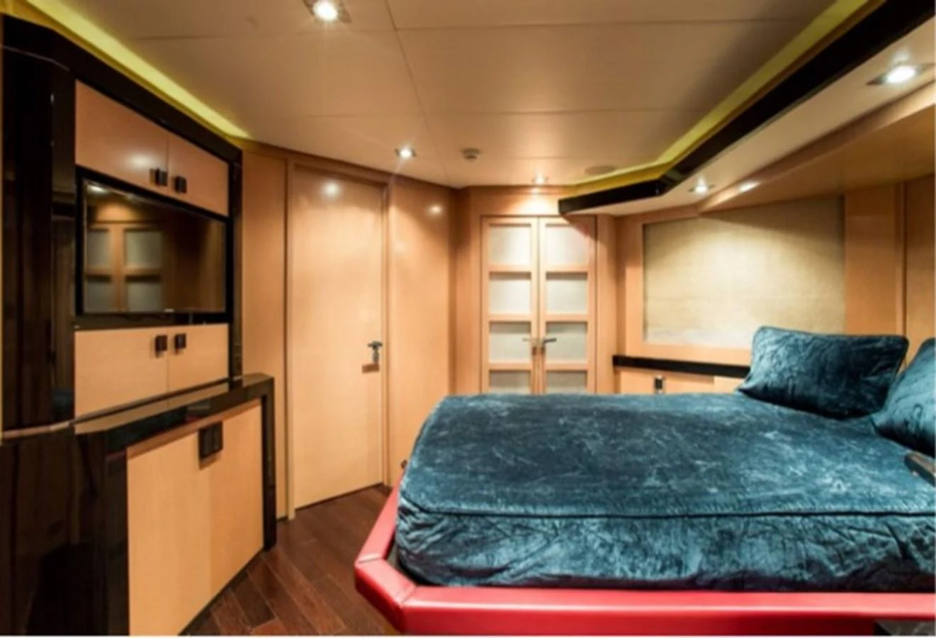 a bed in a room aboard MY IZUMI Yacht for Sale