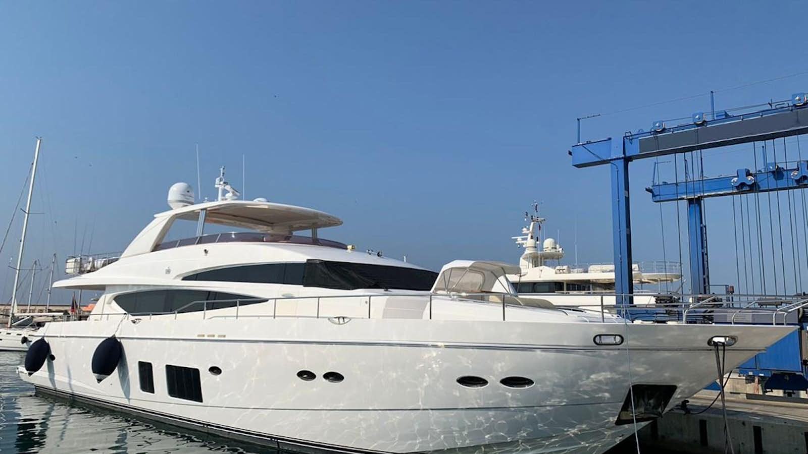 a white yacht docked aboard SEA ARK Yacht for Sale