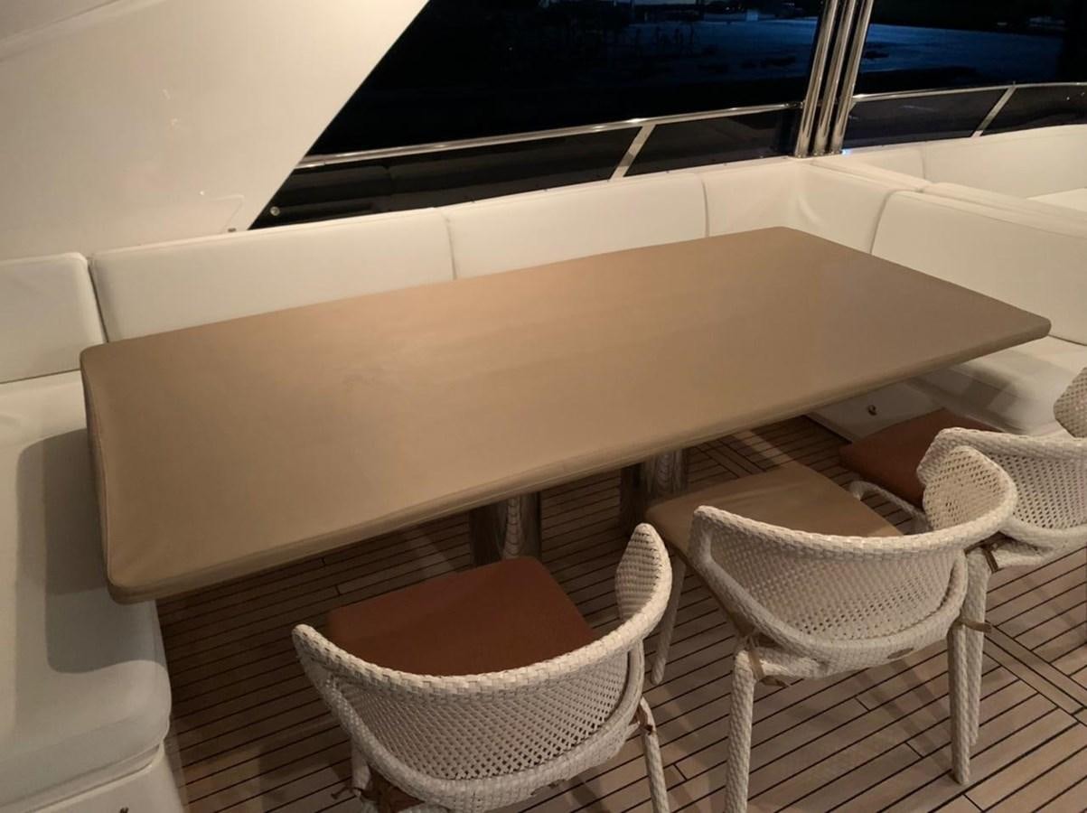 a table and chairs on a boat aboard SEA ARK Yacht for Sale