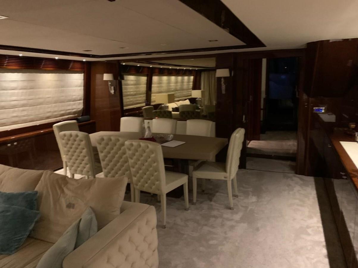 a room with a table and chairs aboard SEA ARK Yacht for Sale