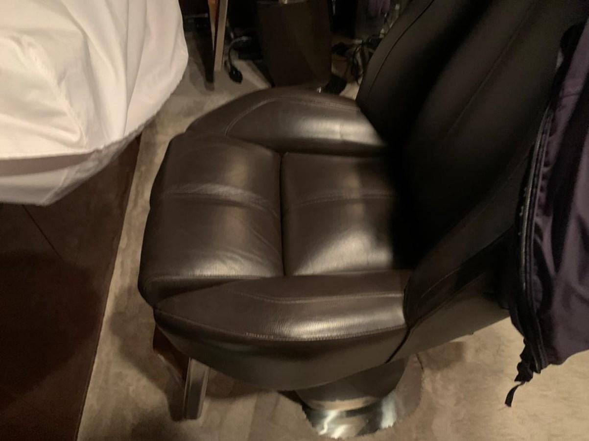 a chair in a room aboard SEA ARK Yacht for Sale