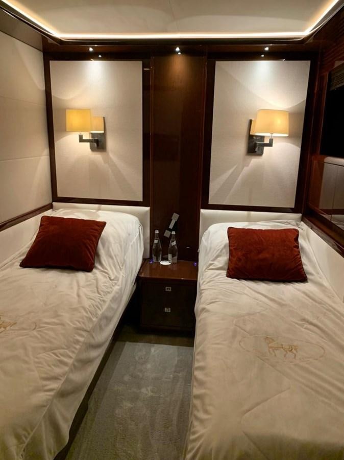 a hotel room with two beds aboard SEA ARK Yacht for Sale
