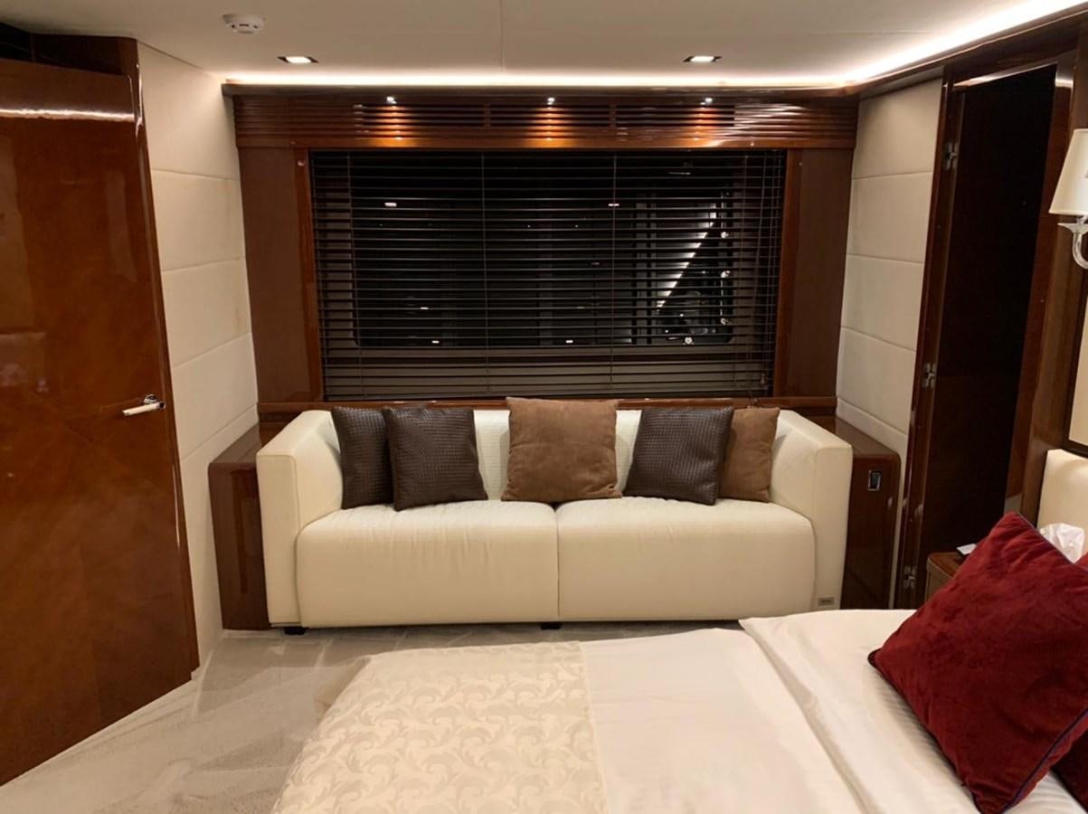 a bed and a couch in a room aboard SEA ARK Yacht for Sale