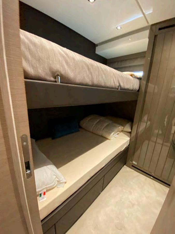 a bed with a white sheet aboard MARITTA’S Yacht for Sale