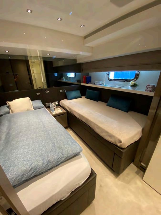 a room with a bed and a couch aboard MARITTA’S Yacht for Sale