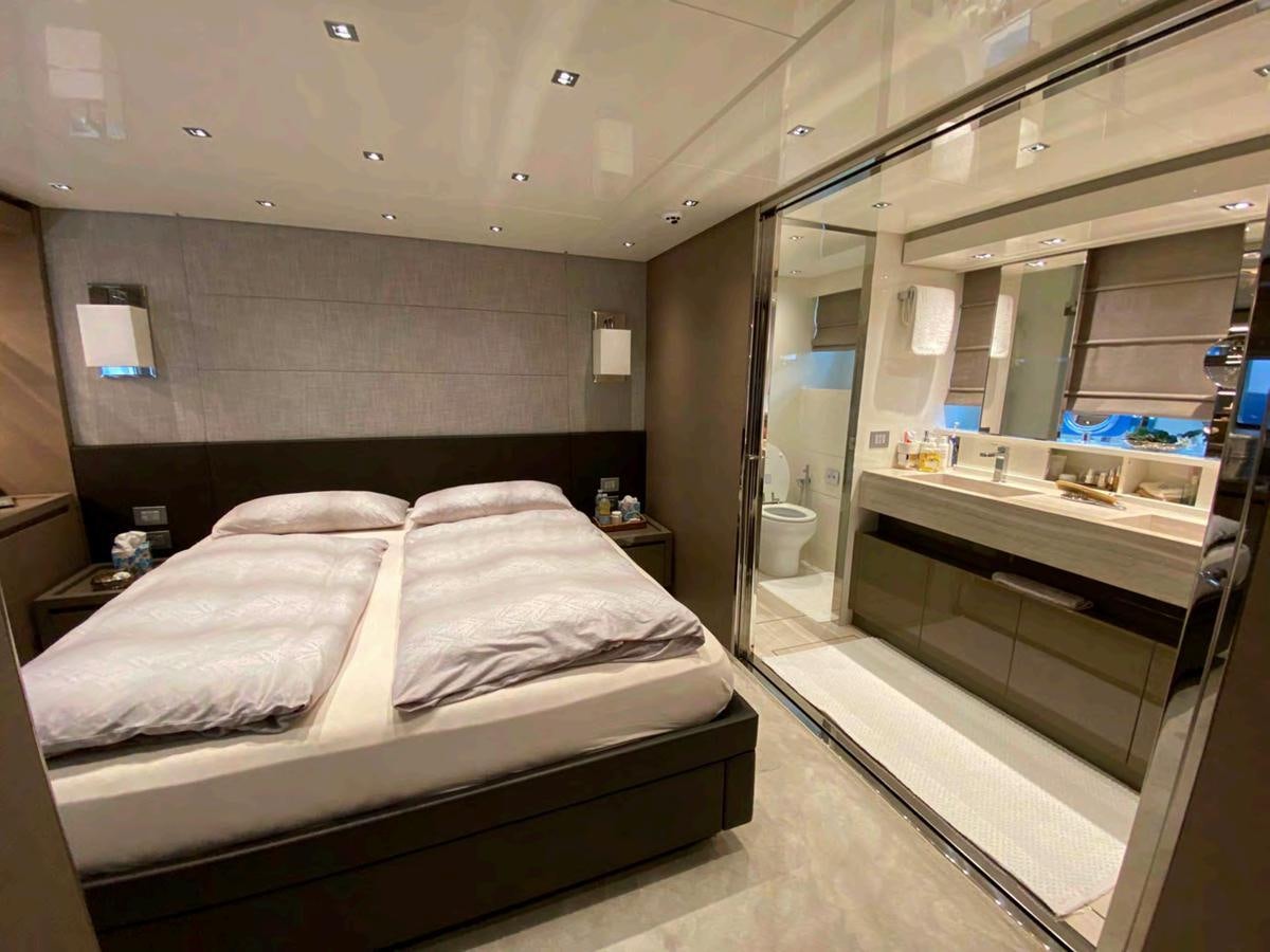 a bed in a room aboard MARITTA’S Yacht for Sale