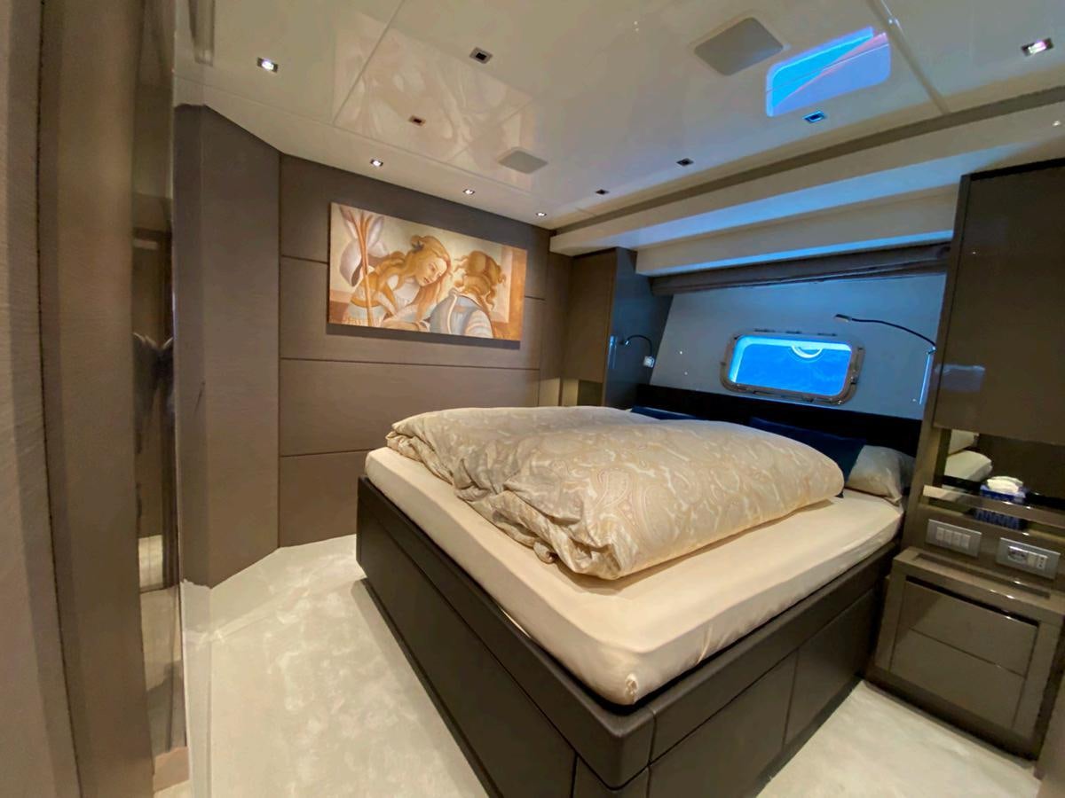 a small room with a bed and a tv aboard MARITTA’S Yacht for Sale