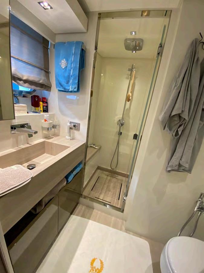 a bathroom with a shower and sink aboard MARITTA’S Yacht for Sale