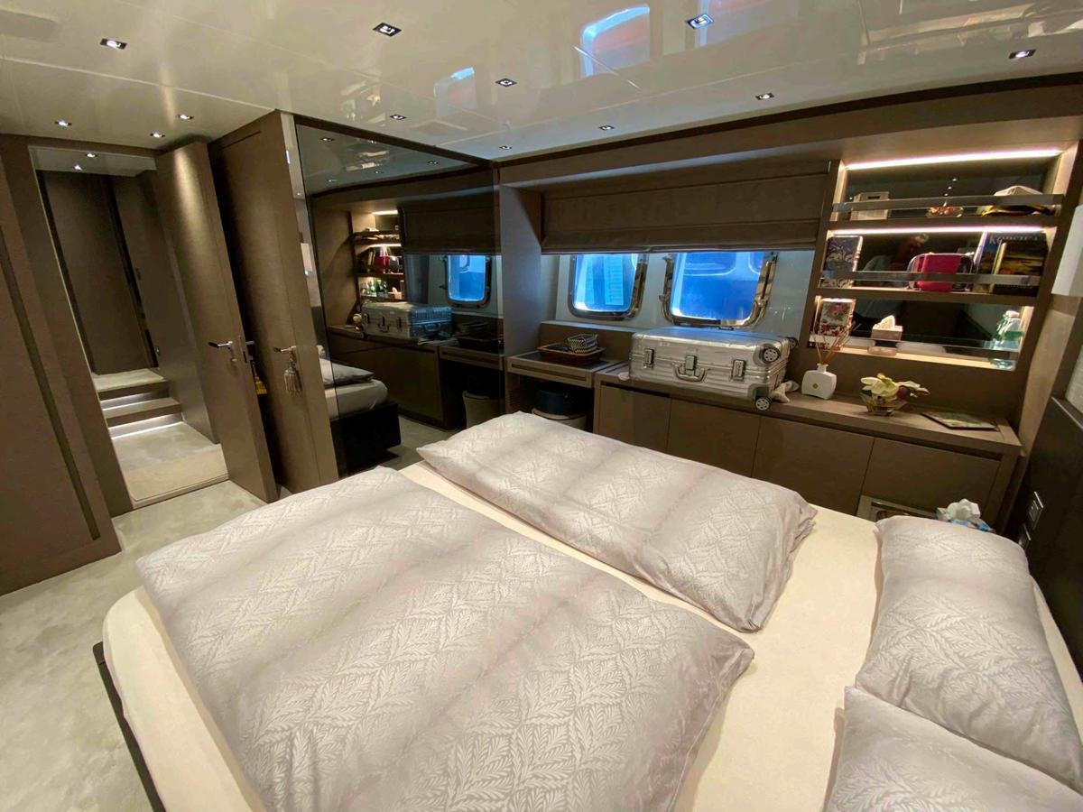 a room with a bed and a desk aboard MARITTA’S Yacht for Sale