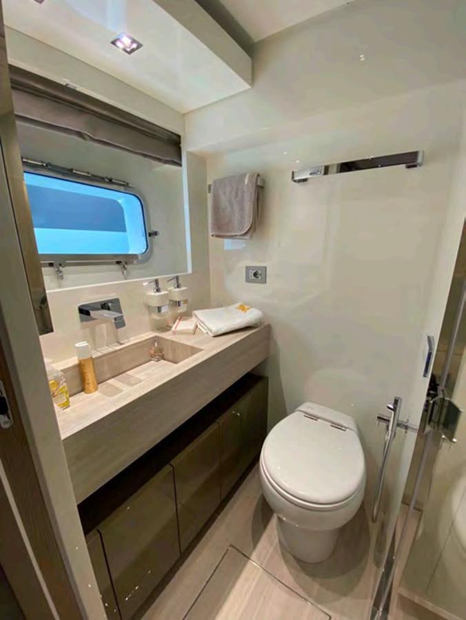 a bathroom with a sink and a toilet aboard MARITTA’S Yacht for Sale