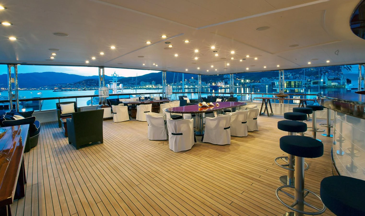 a room with tables and chairs aboard FORCE BLUE Yacht for Sale