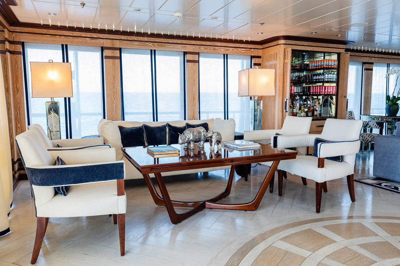a room with a table and chairs aboard FORCE BLUE Yacht for Sale