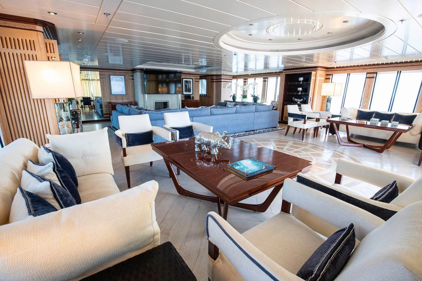 a large room with a table and chairs aboard FORCE BLUE Yacht for Sale