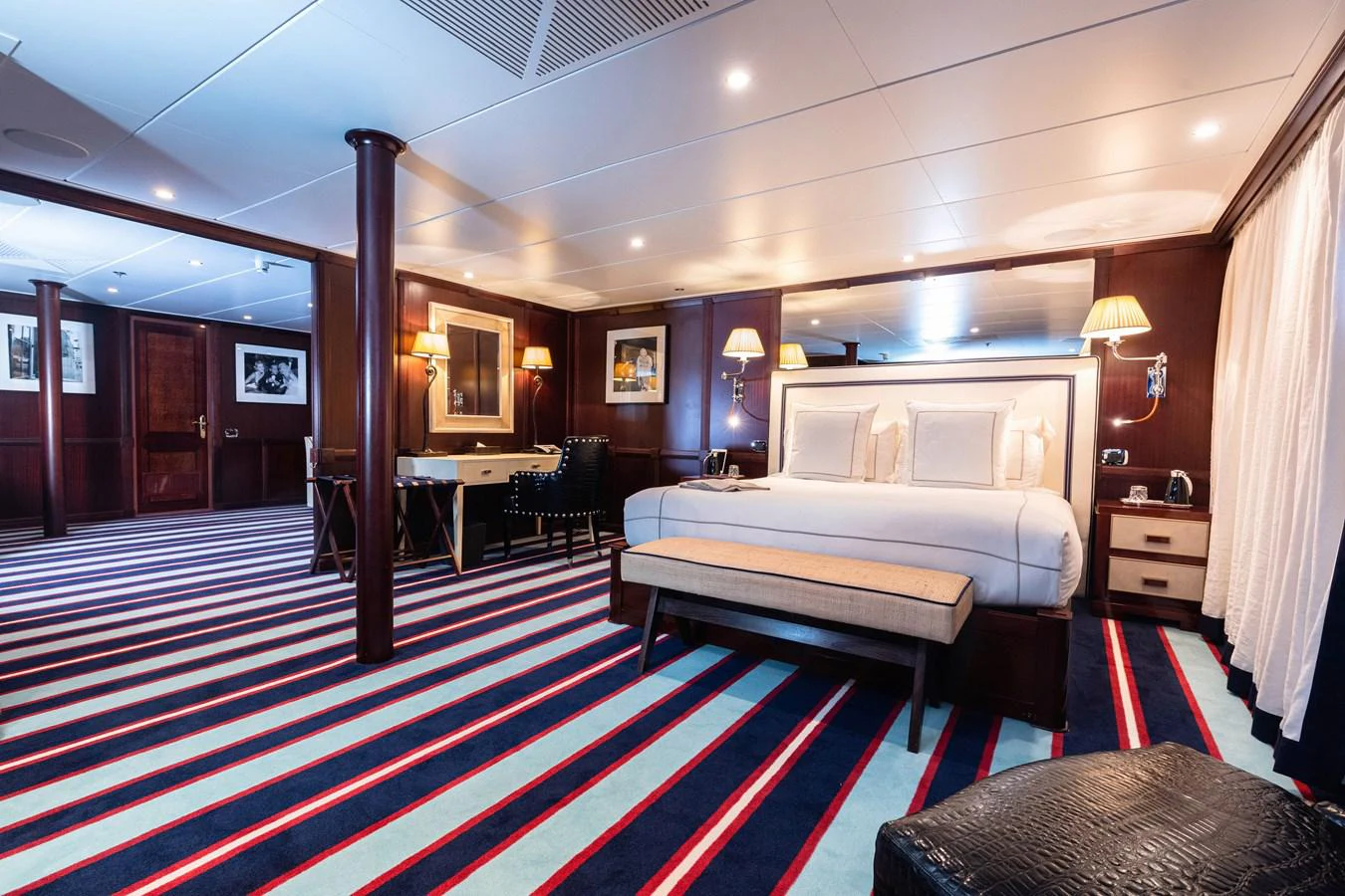 a room with a bed and a table aboard FORCE BLUE Yacht for Sale