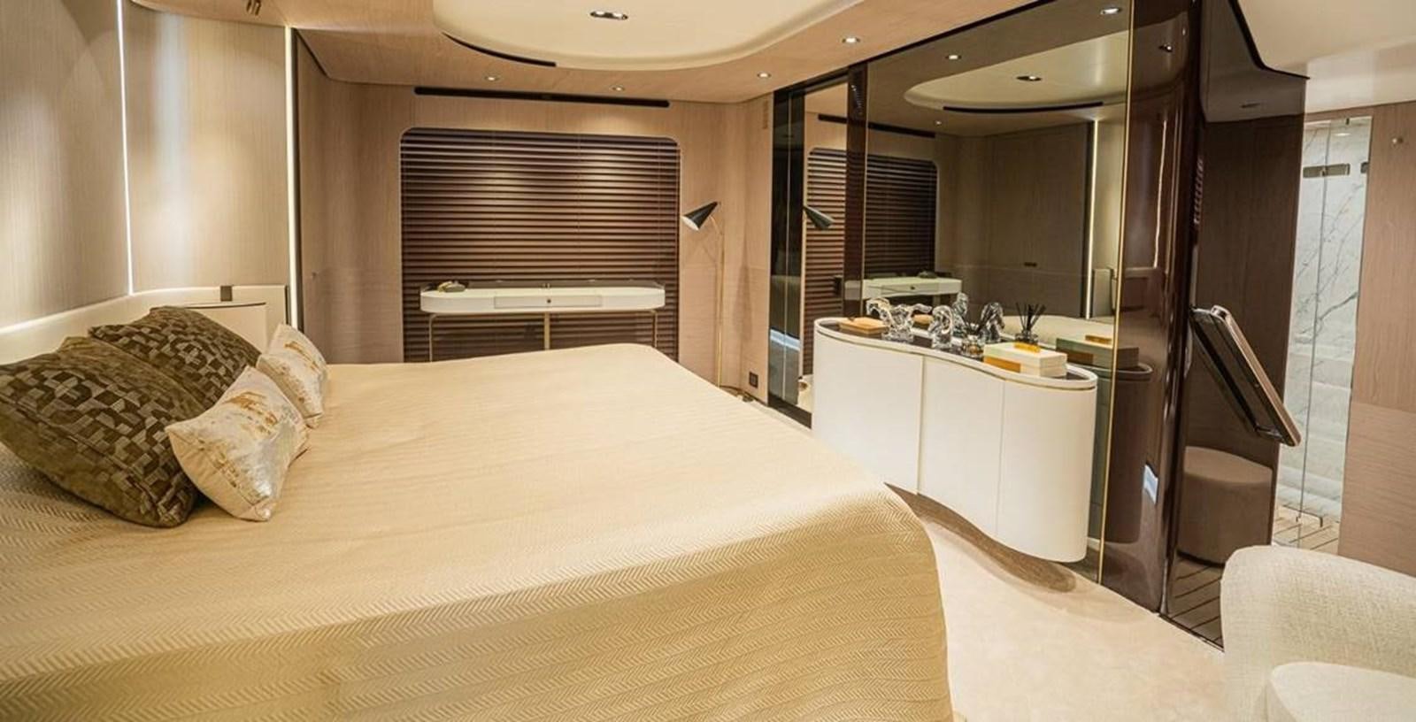 a bedroom with a bed and a mirror aboard LULWA Yacht for Sale