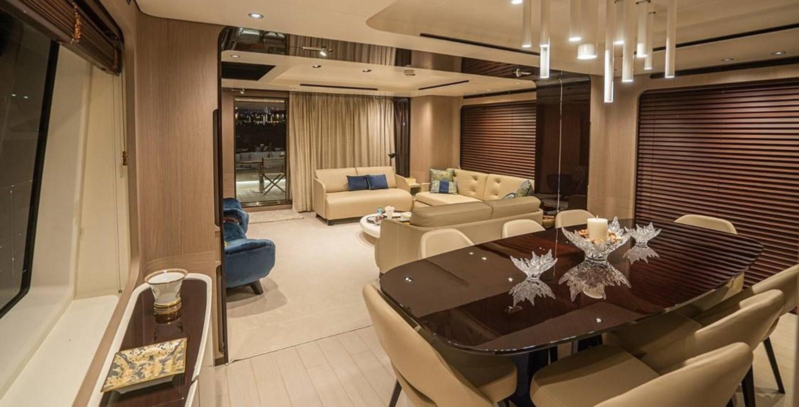 a living room with a couch and a table aboard LULWA Yacht for Sale