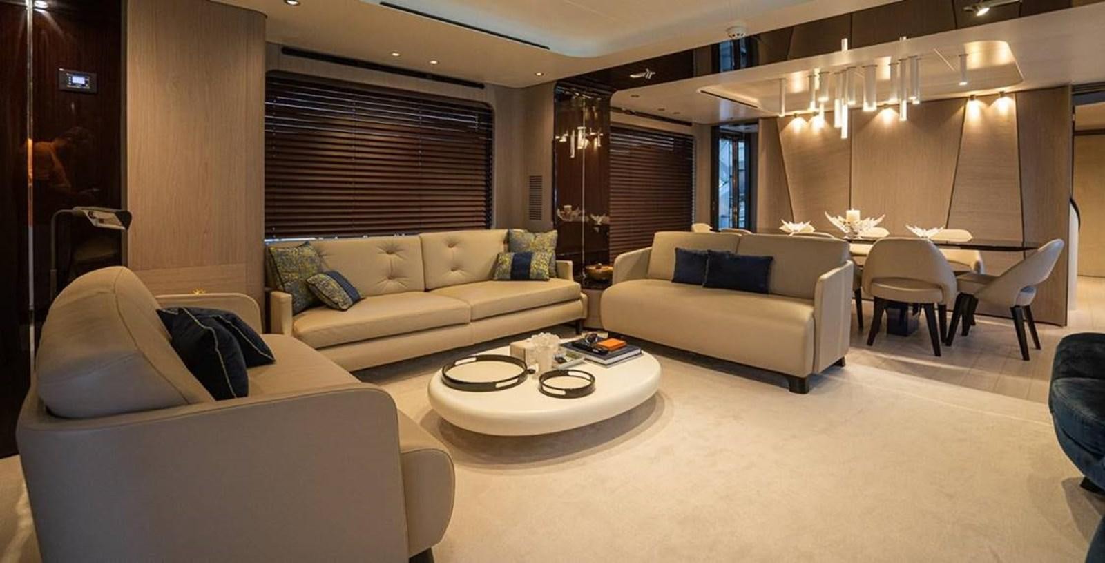 a living room with white furniture aboard LULWA Yacht for Sale