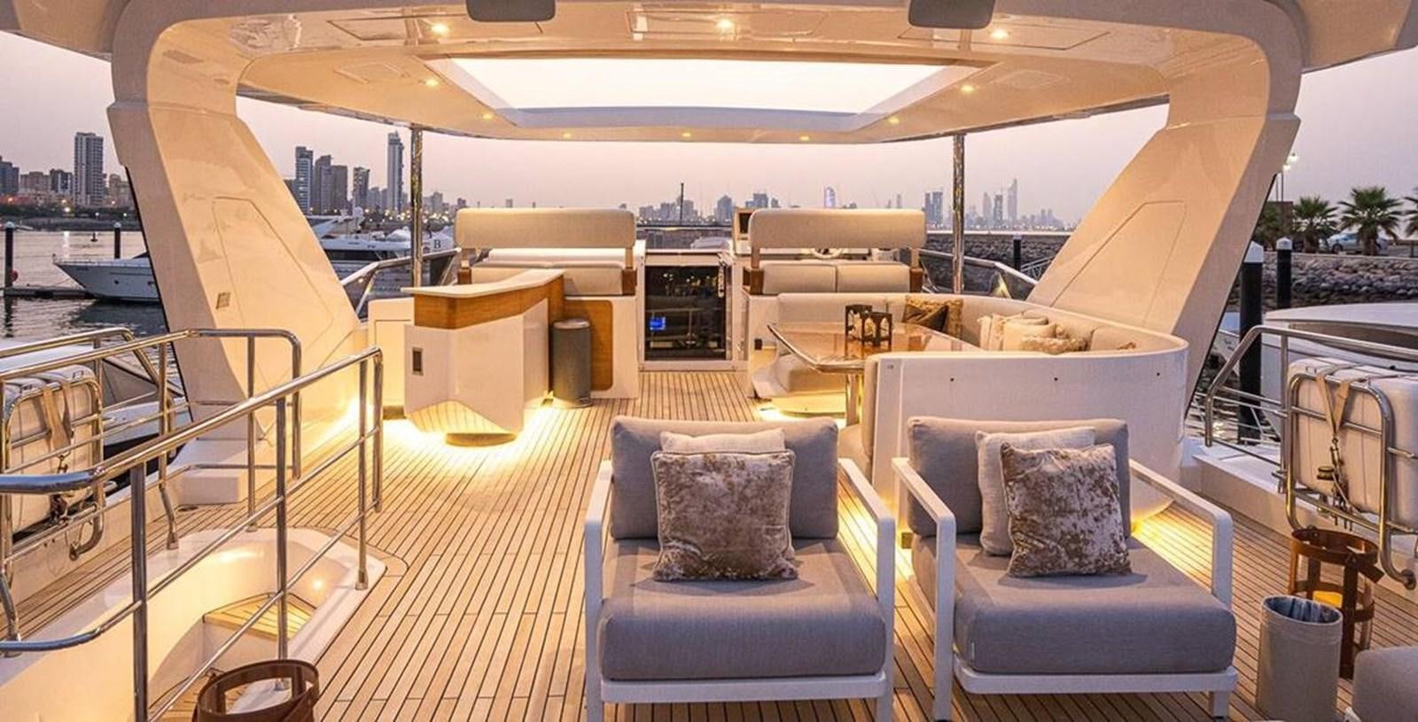 a boat with a couch and a table on it aboard LULWA Yacht for Sale