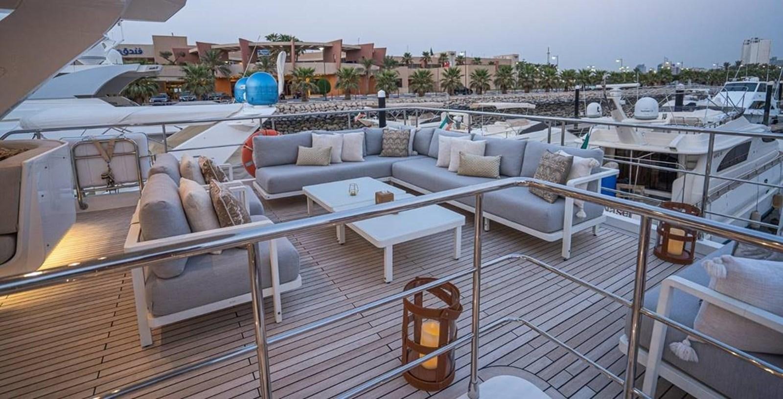 a deck with a couch and a pool aboard LULWA Yacht for Sale