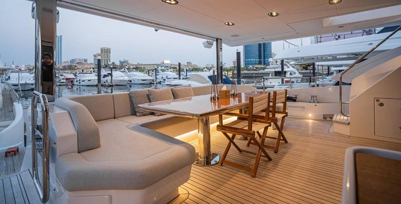 a room with a table and chairs aboard LULWA Yacht for Sale