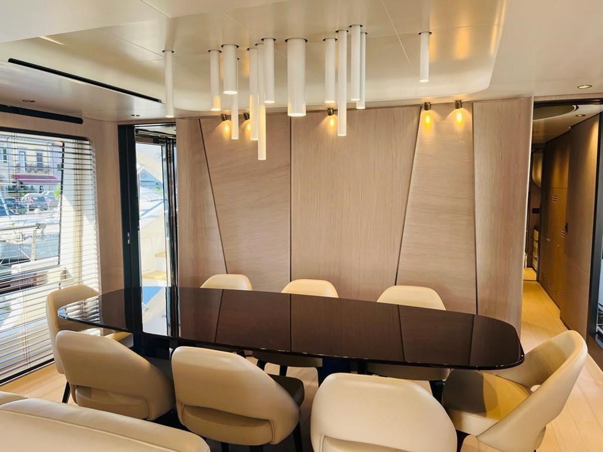 a room with chairs and a table aboard LULWA Yacht for Sale