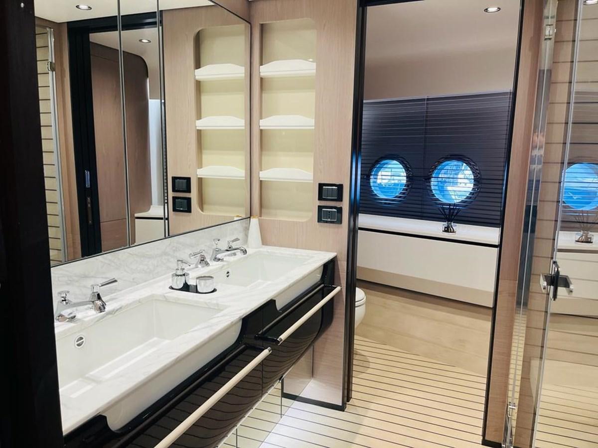 a bathroom with a sink and a large mirror aboard LULWA Yacht for Sale