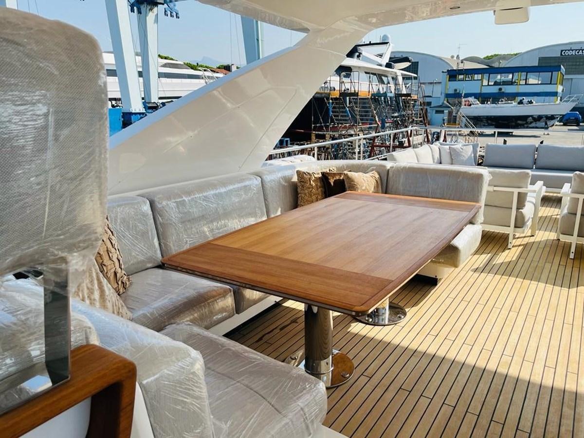 a table on a deck aboard LULWA Yacht for Sale