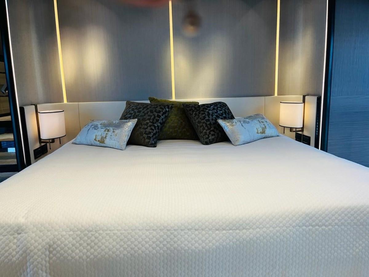 a bed with pillows aboard LULWA Yacht for Sale