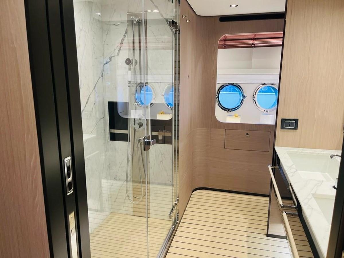 a bathroom with a glass shower aboard LULWA Yacht for Sale