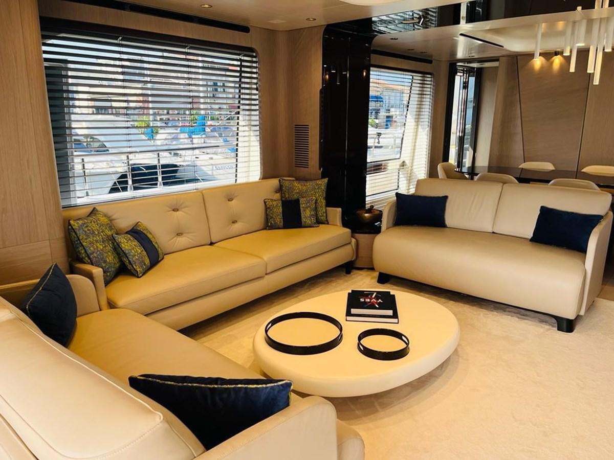 a living room with white couches aboard LULWA Yacht for Sale