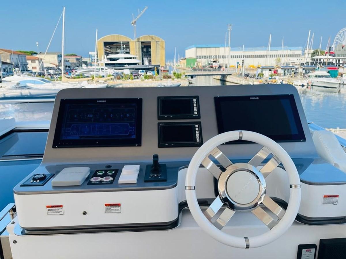 a white car with a black screen on a boat aboard LULWA Yacht for Sale