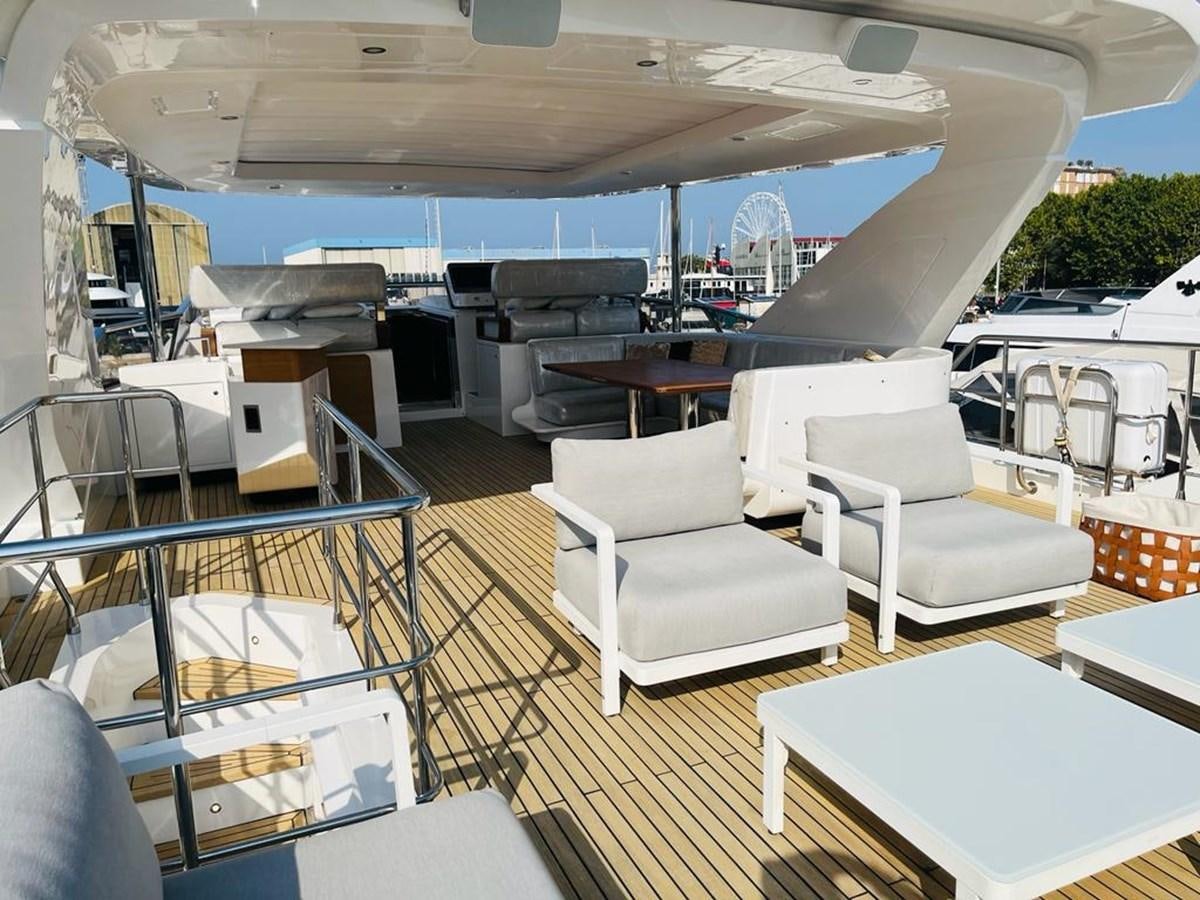 a boat with a table and chairs aboard LULWA Yacht for Sale